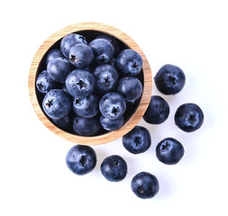 Blueberry in a wooden cup Isolated on a white background. Top view