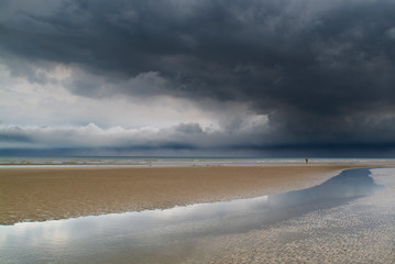 Fototapeta na wymiar sand beach and sea during a storm day in Ostend