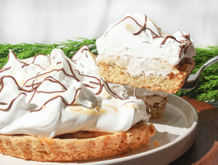 Cookie cake with cream and meringue