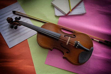 Violin put on blank note sheet,prepare for practice,blurry light around
