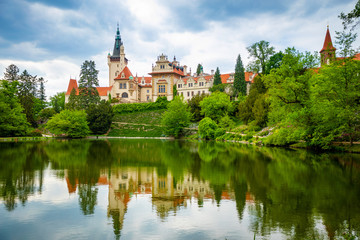 Fototapeta na wymiar Castle with reflection in pond in spring time in Pruhonice, Czech Republic