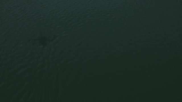 Flying close over water, panning up to reveal Pont Du Diable bridges, France