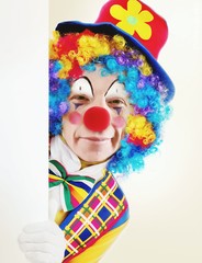 Close-up Portrait Of Clown Against White Background