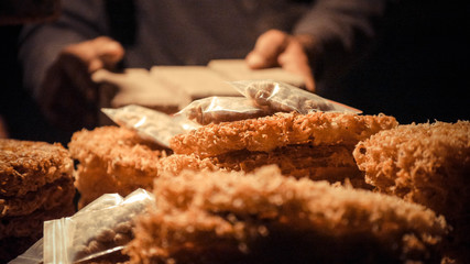 Brown color snack with stack of plastic bag