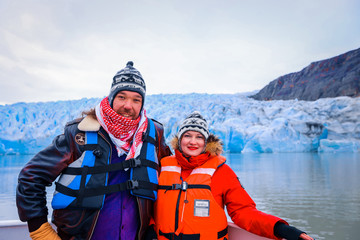 Glacier Gray, Chile - March 09, 2020: Happy Couple on the Touristic Boat to Glacier Gray 
