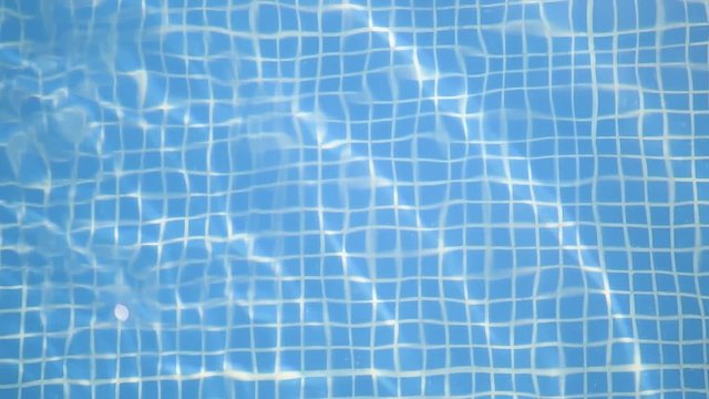 Blue swimming pool bottom texture background 