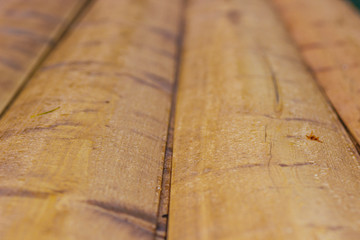 Wooden wall of the house of a peasant hut made of round logs