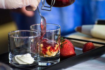 Tasty dessert in glass glasses on the banquet table. Nutrition. Buffet.
