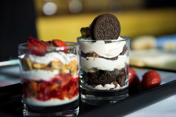 Tasty dessert in glass glasses on the banquet table. Nutrition. Buffet.