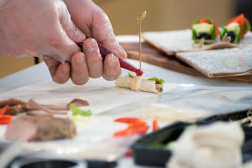 Chef preparing caprese bruschetta in the kitchen