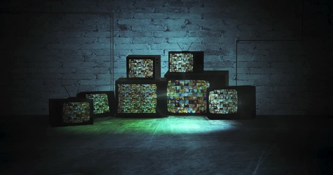 Group of old televisions in a dark room show various videos. Digitally animated video wall