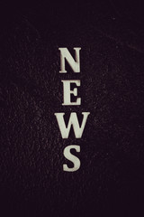 News word concept. News word on blackboard