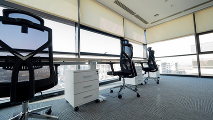 Fototapeta premium View of empty office with three office chairs