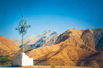 Cross and mountains