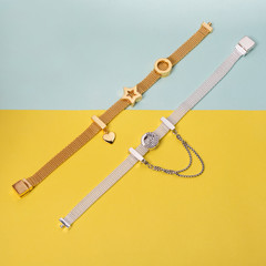 Silver and gold bracelets, jewelry on minimal yellow and blue background. Top view of fashion luxury woman accessories, jewelry and shopping concept. Trendy flat lay composition.