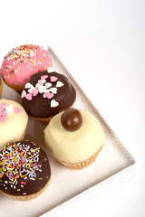 Bright Easter cupcakes with closed decorations. White background. close view. top view. isolated