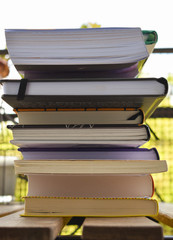 Stack of book of different sizes and color photographed from close up