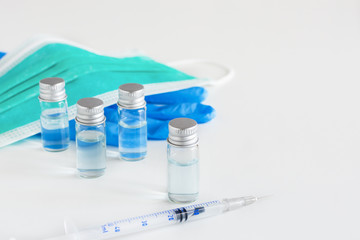 Medical glass vials and syringe for vaccination.