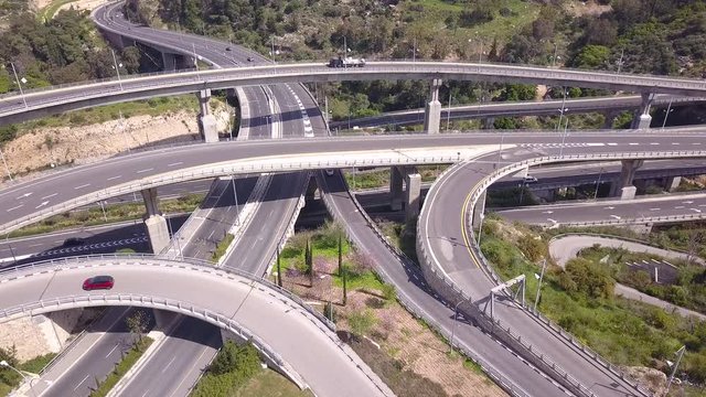 Aerial view of highway road, interchange and overpass in city.
