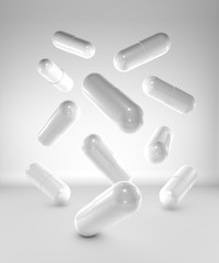Medicine capsules on white background