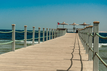 Obraz premium Pier at the hotel .Sharm El Sheikh. Photo on a sunny day. Mountains and the sea..Holidays in 2018.