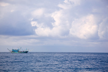 fishing boat in the clouds