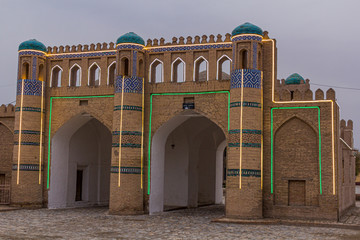 Illuminated ancient gate in Khiva, Uzbekistan