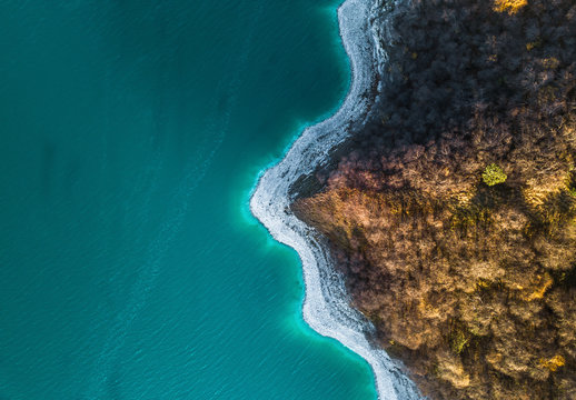 Aerial view of serpentine coastline of pure Kezenoy-am lake in the mountains, Chechen republic, Russia