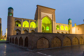 Night view of Kutlug-Murad Inaq Madrasa in the old town of Khiva, Uzbekistan