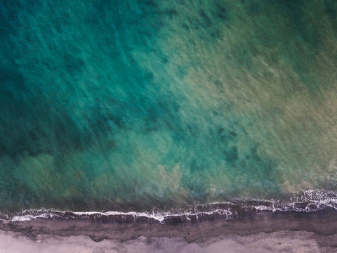 Aerial top down view of  waves crashing on Matapalo Beach in Guanacaste Region, Costa Rica