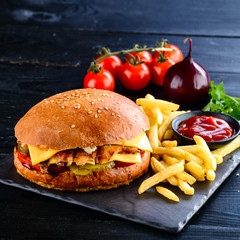 set of burgers with French fries