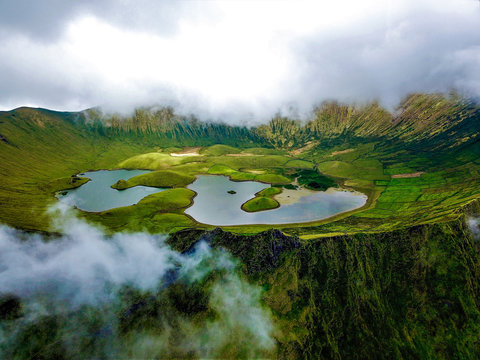 Aerial view of Caldeir&bdquo;o volcano crater on Corvo Island, Azores, Portugal.