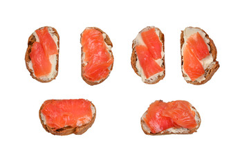 Salmon on a bread with cream isolated on white.