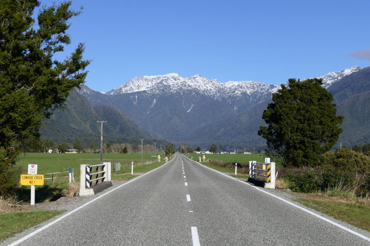 On Highway SH6 in New Zealand towards the Mount Cook Mountain Range between Greymouth and the Franz Josef Glacier Village