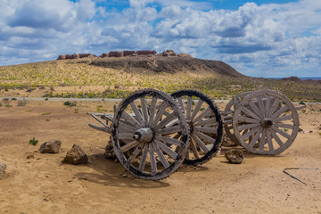 Obraz premium Old wooden carts near Ayaz Qala fortress in Kyzylkum desert, Uzbekistan