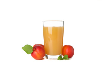 Glass with juice and apricots isolated on white background