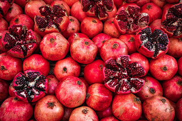 Many pomegranate cut in half, pomegranate background