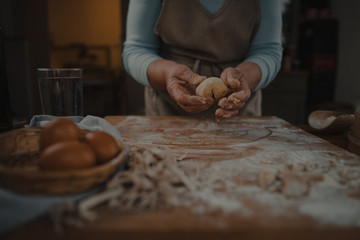 grandmother prepares fresh homemade pasta