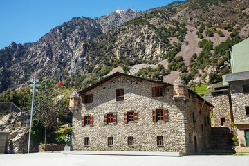 Old stone house on a background of mountains