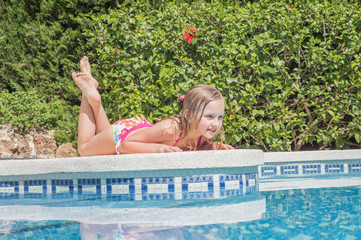 Beautiful girls at swimming pool in summer time