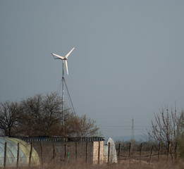 A small wind turbine against the sky © Stanimir