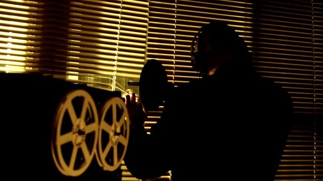 The special agent overhears the conversation with a directional microphone