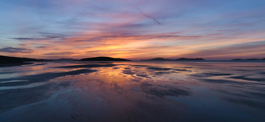 Drone sunset views of Barra Airport in Scotland. Highland drone shoot