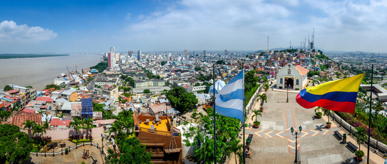 Panoramic photo of Guayaquil, Ecuador, South America, with flag and church from the mirador. Selective focus.