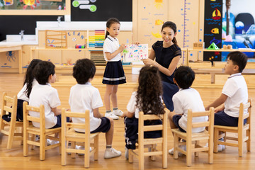 Teacher and children in art class