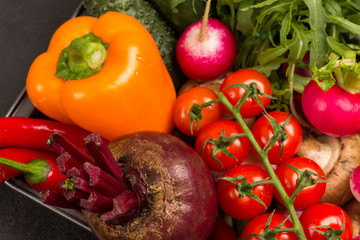 Orange peppers, beets and cherry tomatoes.