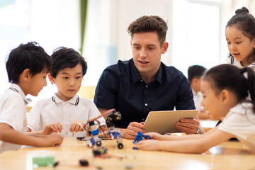 Children learning coding in classroom