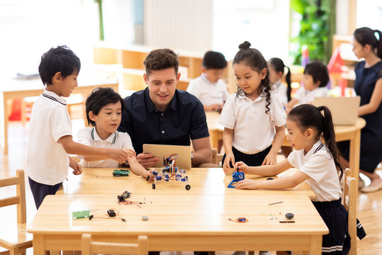 Children learning coding in classroom