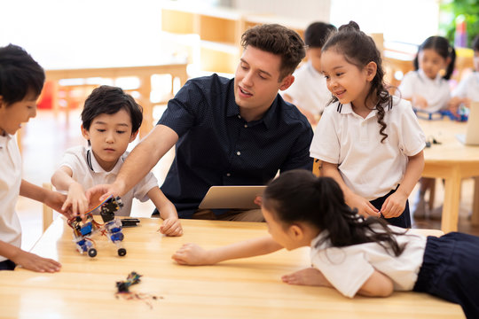 Children learning coding in classroom