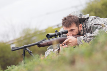 Fototapeta premium shooting a weapon with sniper